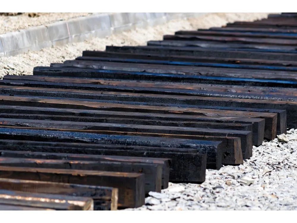 a lot of wooden sleepers standing on the ground